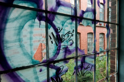 Graffiti on window on block of flats